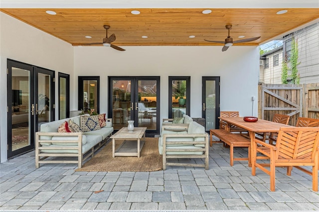 view of patio featuring outdoor lounge area, french doors, and ceiling fan