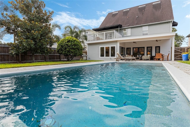 view of swimming pool with ceiling fan, an outdoor hangout area, and a patio area