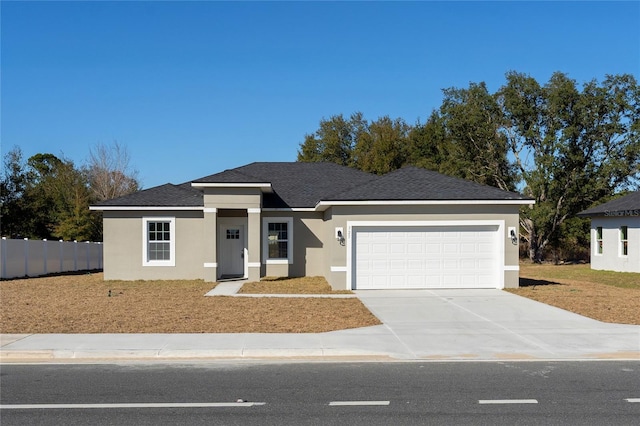 view of front of property with a garage