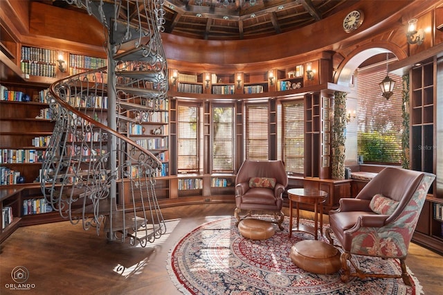 sitting room featuring beamed ceiling, plenty of natural light, and a towering ceiling