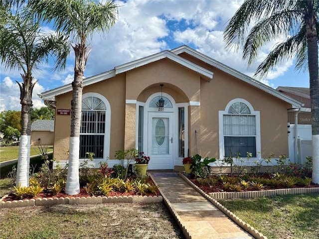 281 San Gabriel St, Winter Springs, FL 32708 - view of exterior entry with stucco siding
