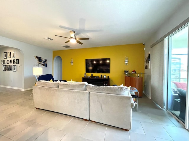 living room featuring ceiling fan and light tile patterned floors