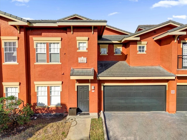 multi unit property featuring a garage