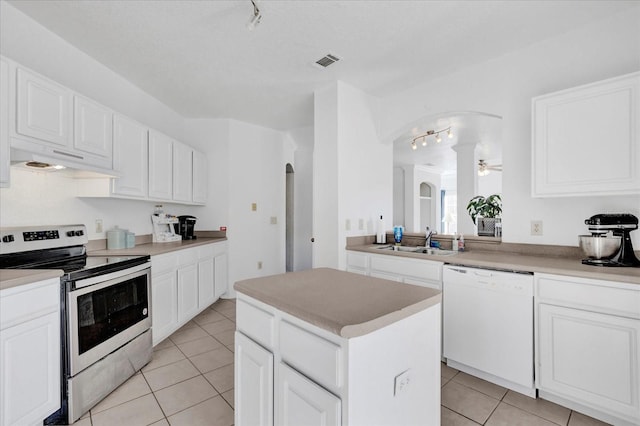 kitchen with a kitchen island, white cabinetry, sink, stainless steel range with electric stovetop, and white dishwasher