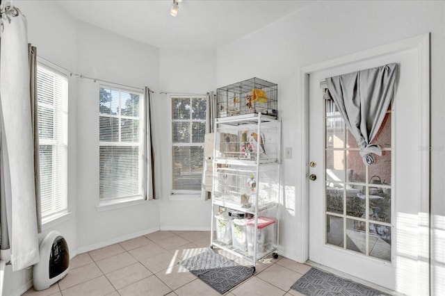 entryway with light tile patterned floors