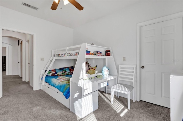 bedroom with ceiling fan and carpet floors