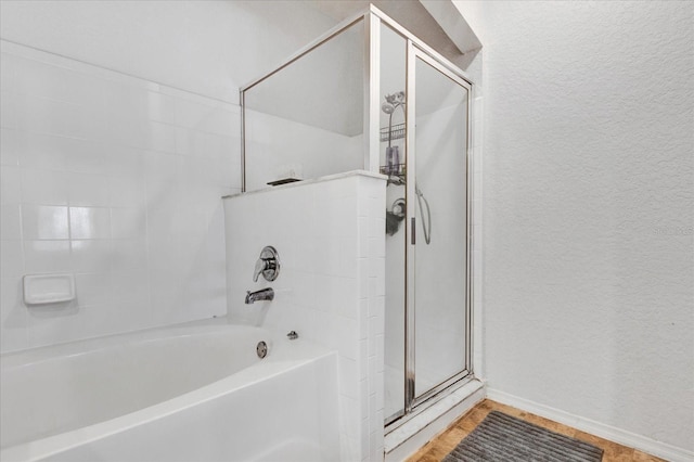 bathroom featuring plus walk in shower