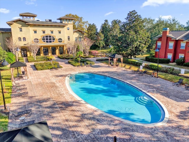 view of pool featuring a gazebo and a patio