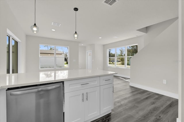 kitchen featuring white cabinets, wood-type flooring, dishwasher, and decorative light fixtures