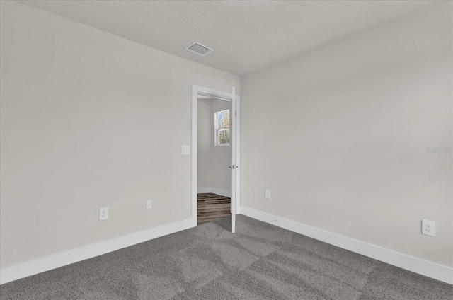 spare room with carpet floors