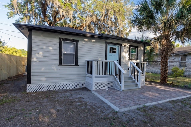 view of front of house with a patio area