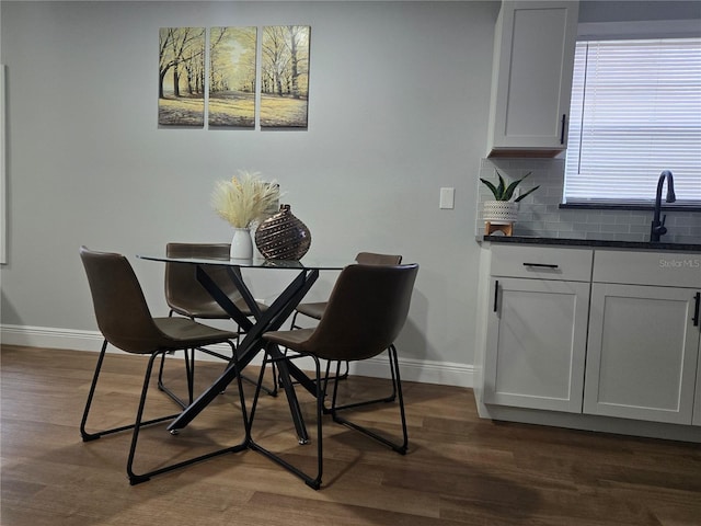 812 S Locust Ave, Sanford, FL 32771 - dining area with dark wood-style flooring