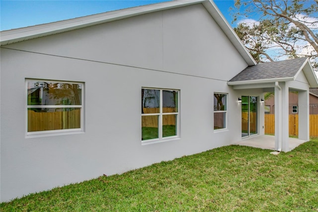 back of house featuring a yard