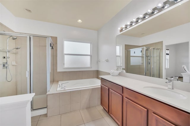 bathroom featuring tile patterned floors, vanity, and independent shower and bath