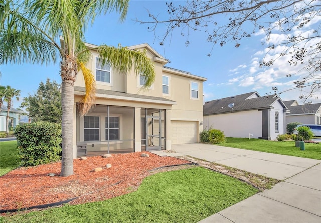 view of front of property featuring a garage and a front yard