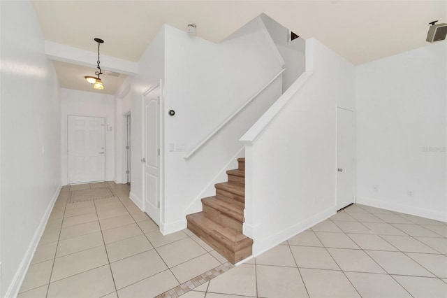 stairs with tile patterned flooring