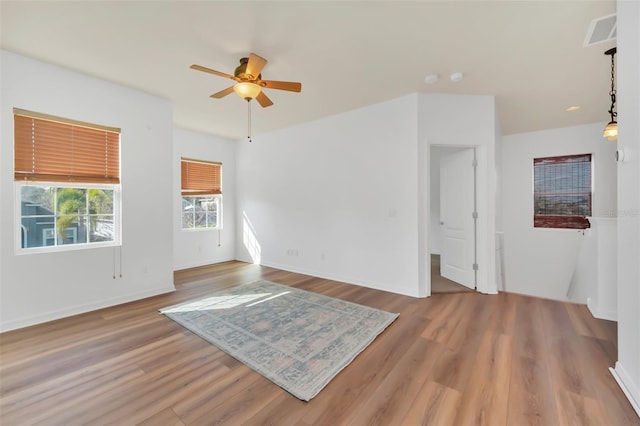 unfurnished room featuring hardwood / wood-style flooring and ceiling fan