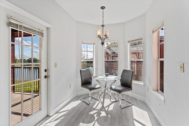 dining space with a chandelier