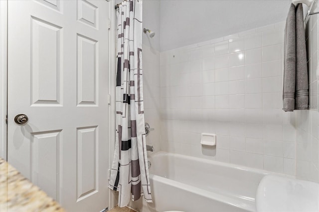 bathroom featuring shower / bath combo with shower curtain