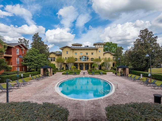 view of swimming pool with a patio area