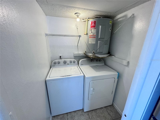 laundry area featuring independent washer and dryer, water heater, and light tile patterned floors