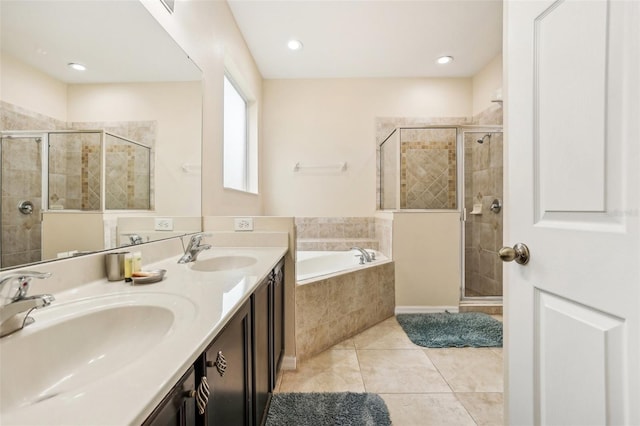 bathroom featuring tile patterned floors, independent shower and bath, and vanity