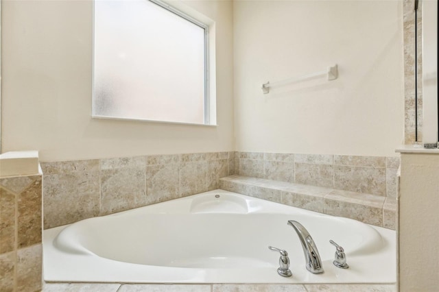 bathroom featuring a relaxing tiled tub