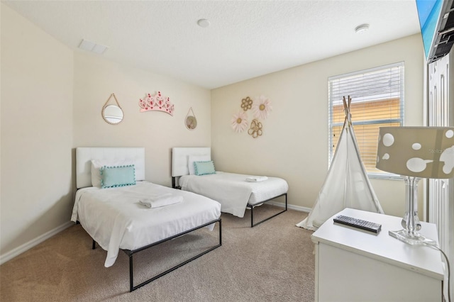 carpeted bedroom with a textured ceiling