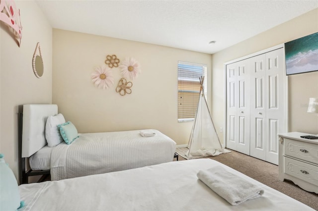 carpeted bedroom with a closet