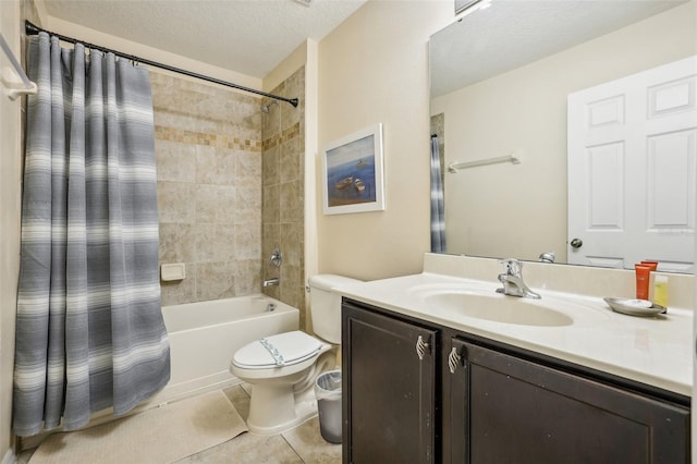 full bathroom with vanity, toilet, tile patterned floors, a textured ceiling, and shower / bath combo with shower curtain