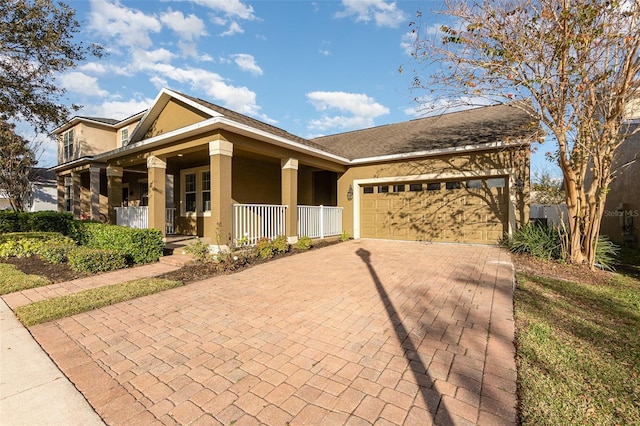 view of front of property featuring a porch and a garage