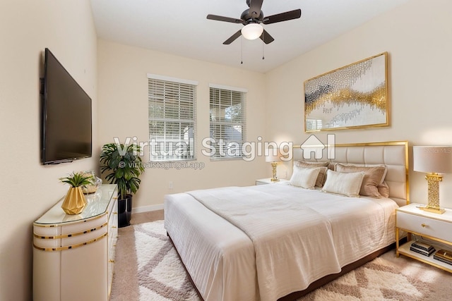 bedroom featuring ceiling fan and light colored carpet