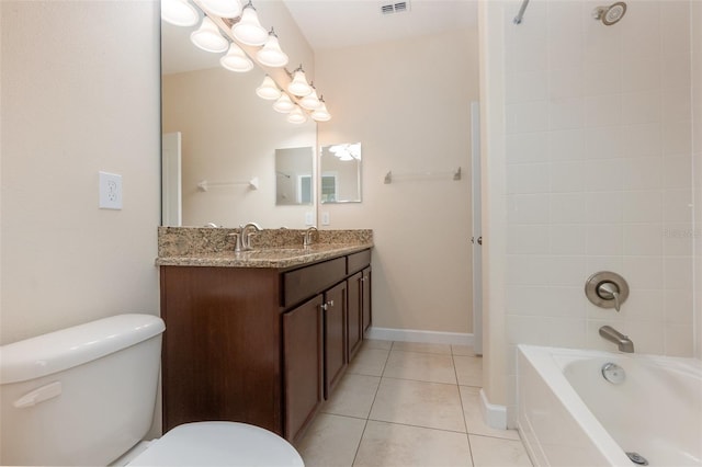 full bathroom with vanity, tiled shower / bath combo, tile patterned floors, and toilet