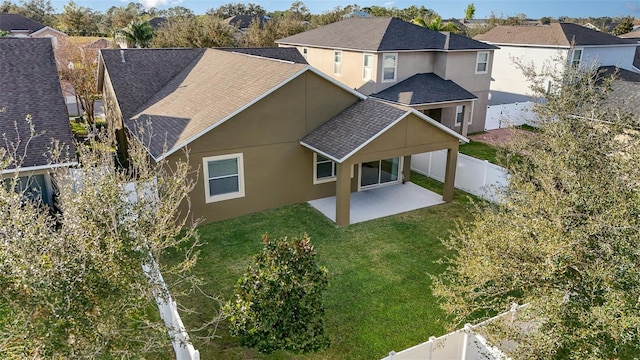 exterior space featuring a patio and a lawn