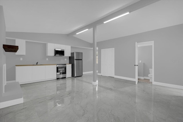 unfurnished living room with lofted ceiling with beams and sink