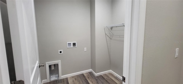 clothes washing area featuring laundry area, baseboards, dark wood finished floors, washer hookup, and electric dryer hookup