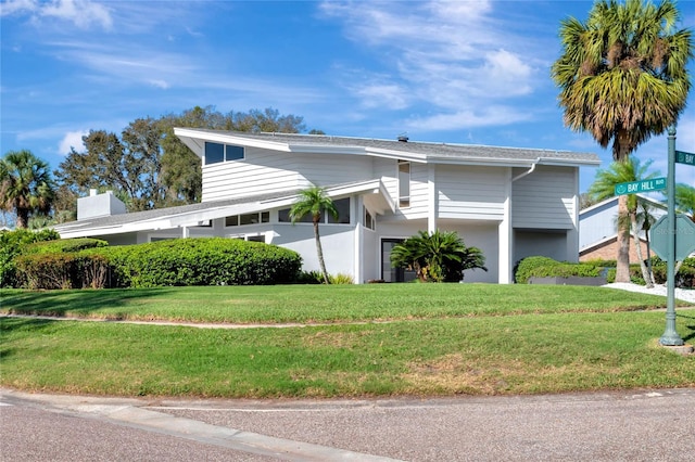 view of front of property with a front lawn