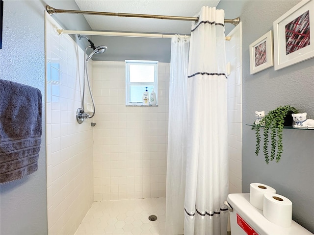 bathroom with a shower with shower curtain