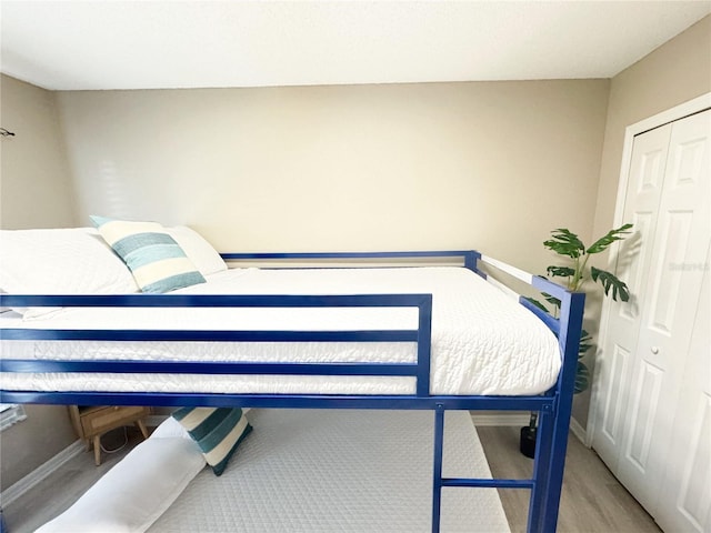 bedroom with hardwood / wood-style flooring