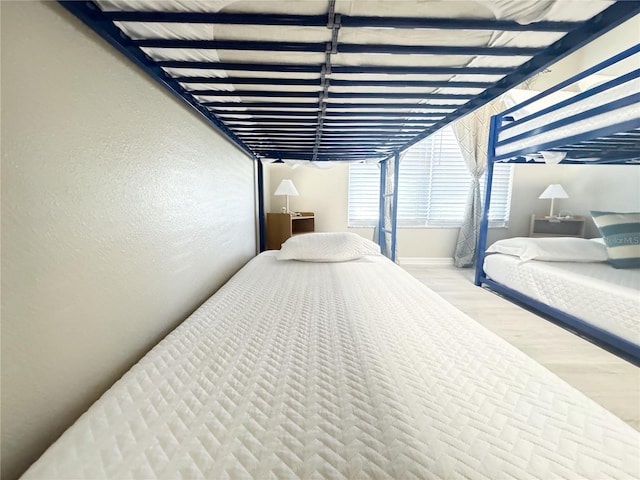 bedroom with light wood-type flooring