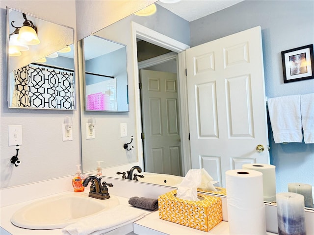 bathroom with vanity and walk in shower