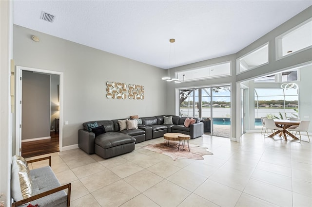 tiled living room with a textured ceiling