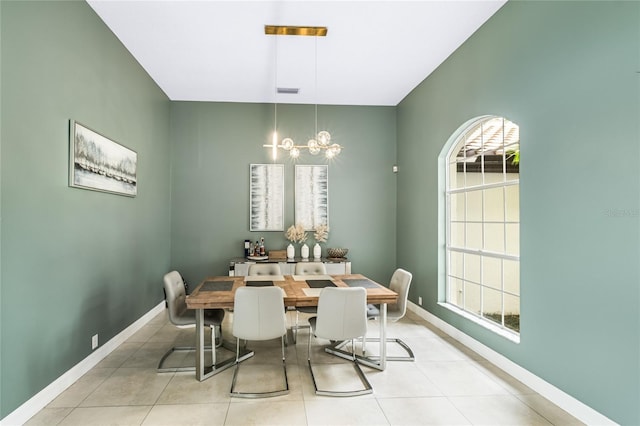 tiled dining space with a notable chandelier