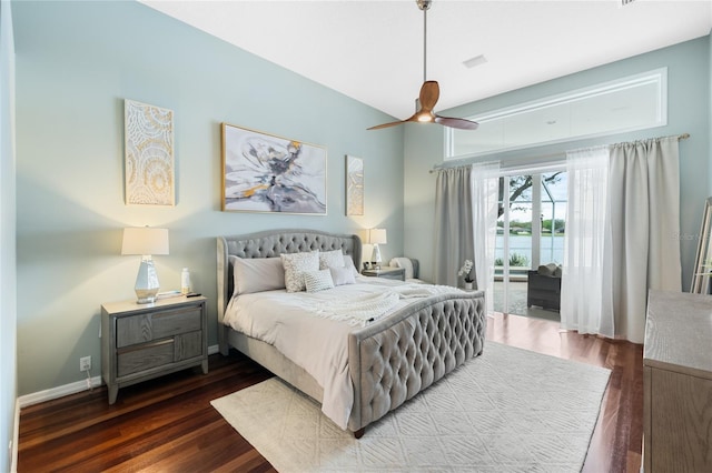 bedroom featuring ceiling fan, access to outside, and dark hardwood / wood-style floors