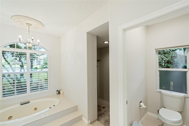 bathroom with a textured ceiling, toilet, independent shower and bath, and a notable chandelier