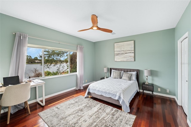 bedroom featuring ceiling fan and dark wood-type flooring