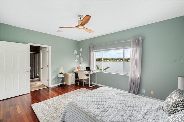 bedroom with ceiling fan and dark hardwood / wood-style flooring