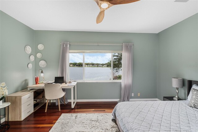 bedroom with ceiling fan and dark hardwood / wood-style floors