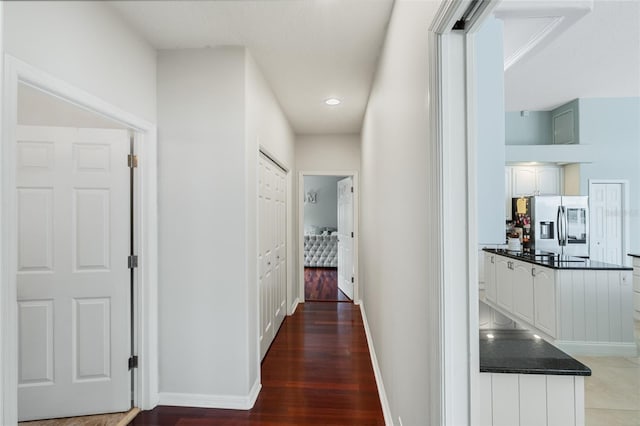 corridor featuring dark hardwood / wood-style flooring