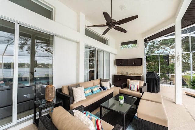 interior space with ceiling fan